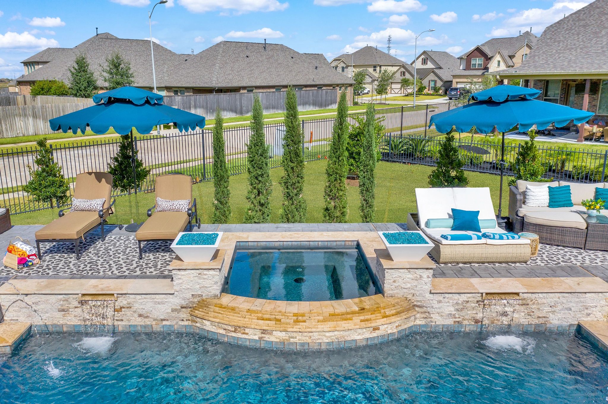 Freeform custom pool with curved edges and blue water